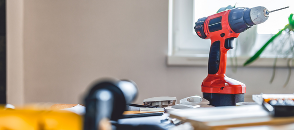 Power tools spread across a table.